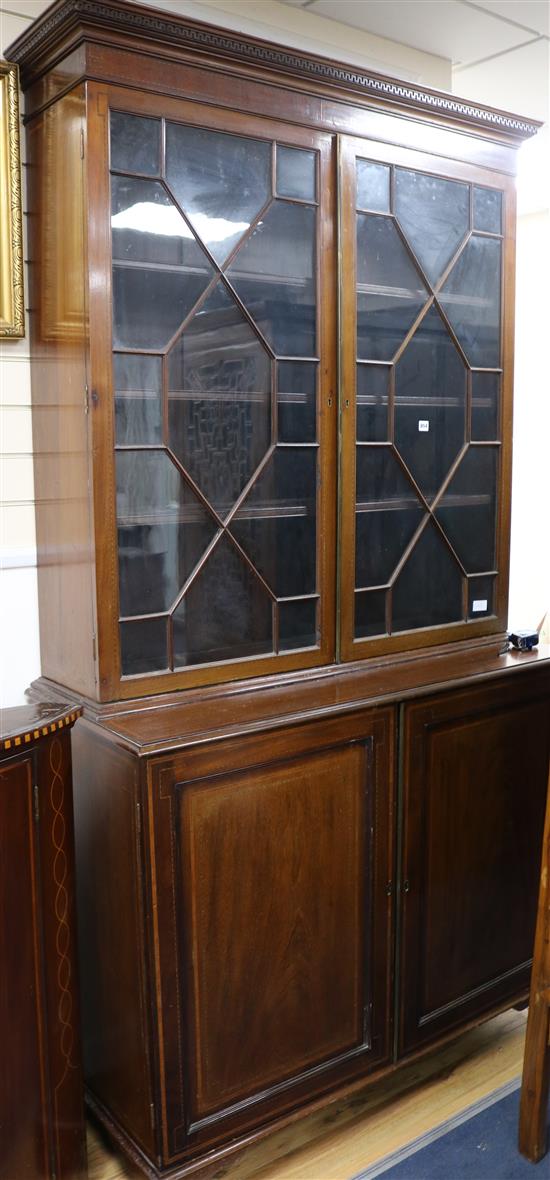 An Edwardian inlaid mahogany bookcase W.125cm